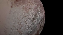 The texture of Pluto in this photo is due to giant spikes of iceNASAJHUAPLSWRI The landscape type which is only found in high-altitude areas around the dwarf planets equator is covered with fields of giant Pentests as tall as the Eiffel tower with peaks l