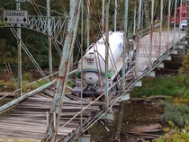 The tragic results when a  ton water truck tried to cross a -year old iron truss Pollocks Mill Bridge Greene County Pennsylvania  