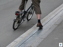 The Trampe bicycle lift in Trondheim Norway A pedal on the road that goes up a hill pushing cyclists