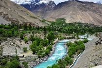 The turquoise blue river Gilgit flowing through the Chitral Valley in Khyber-Pakhtoonkhwa Pakistan  by Asim Nisar Bajwa