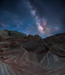 The undulating Navajo sandstone formations of The Wave resting under the galactic core th tries at the ticket lottery to get here- totally worth it North Coyote Butte Arizona 