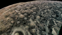 The uneven stormy surface of Jupiter