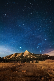 The view of the Flatirons from Chautauqua Park on a starry night in Boulder Colorado is incredible 