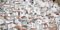 The white buildings and brown rooftops of Casares Spain Photo credit to Francisco Moreno