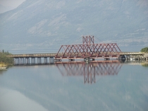 The White Pass and Yukon Route rail bridge over the strait between Bennett Lake and Nares Lake in Carcross 