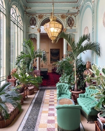 The Winter Garden inside the Htel de la Pava a large th century townhouse that has been used as a gentlemens club for more than a century Avenue des Champs-lyses Paris France