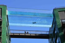 The worlds first transparent acrylic swimming pool bridge that hangs suspended between two tower blocks in London
