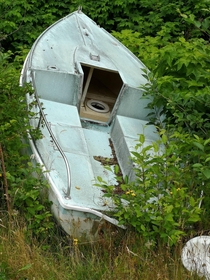 This abandoned speed boat with a toilet