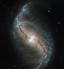 This new Hubble image is a snapshot of NGC   a barred spiral galaxy discovered in  by James Dunlop This close-up view of the galaxy was captured by Hubbles Wide Field and Planetary Camera  WFPC