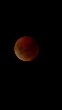 This picture I took from the super wolf blood moon Celestron telescope and a Moto g