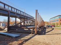 This Under Construction Footbridge will allow people using the Cochituate Rail Trail to walk or bike over Commonwealth Road in Natick MA near the Golden Triangle improving walkability dramatically 