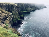 Took a muddy hike through the fog from Doolin Ireland to see the Cliffs of Moher 