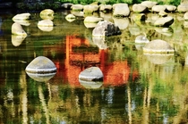 Took from a park in Tokyo Japan No man-made stuffs here but the reflection of the red bridge enlightens what Zen really means