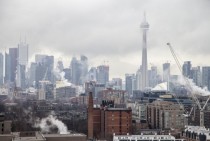 Toronto Through Cranes Smoke and Fog 