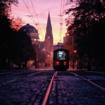 Tram rolling in the sunset of the Polish city of Poznan x