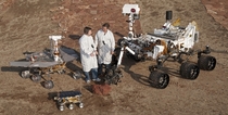 Two engineers stand with the three generations of Mars rovers developed at NASAs Jet Propulsion Laboratory  xpost rTechnologyPorn