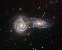 Two interacting spiral galaxies creating a singular astronomical object named Arp  located  million light years away The final image captured by VIMOS an instrument on ESOs VLT Very Large Telescope Credit - ESOJuan Carlos Muoz 