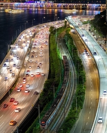 Two types of traffic passing along Han River Seoul South Korea 