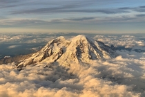 Typically Im annoyed of flights getting delayed on this occasion not so as  mins of delay caused my flight to flew by Mount Rainier Washington around golden hour