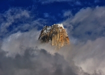 Uli Biaho Tower m rising above the clouds - Part of the Trango Towers in the Baltoro Range  By Sikander Khan 