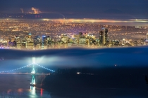 Vancouver Canada A friend of mine thought this picture was a photoshop creation or something like that Its not Its actually just a trick of the fog making it look like two photos put together Its just lucky or perhaps I should say patient timing writes Ma