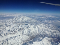 View of the Himalayas in Afghanistan while flying to New Delhi shot with cell phone 