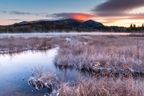Volcanic Winter Lenticular clouds lit up during a wintry sunrise in the Adirondack Mountains NY 