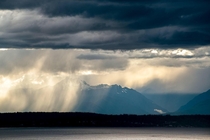 Watched this storm roll in over the Olympic Mountains from my window 
