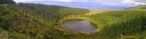 Water and tree filled volcano crater Azores 