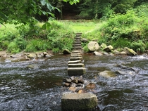 Water flowing through stepping stones at Hardcastle Crags National Park 