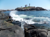Waves crashing at the Nubble Lighthouse in York Maine 
