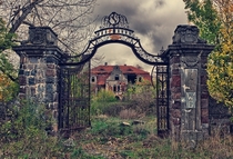 Welcome to the Gates of Hellplease step in inside and make yourself at home Abandoned palace in Poland Photo by Lukasz Malkiewicz 