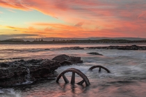 Wheels of Opportune Windang NSW Australia The wheels of an s trolley from construction of a failed harbour which started in the s standing amongst the beating of the ocean in a blistering sunset on the last day of Summer   IG jyeberryphoto