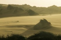 Wind blows over dunes at Guincho Portugal 