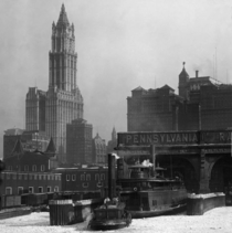 Woolworth building with Pennsylvania Railroad ferry in foreground 
