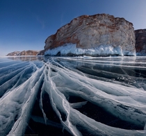 Worlds oldest lake Baikal Siberia covered in thick clear ice  Daniel Korzhonov  satorifoto