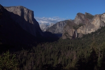 Yosemite Valley El Capitan to the left Bridal Veil falls on the right and half-dome below the clouds in back 